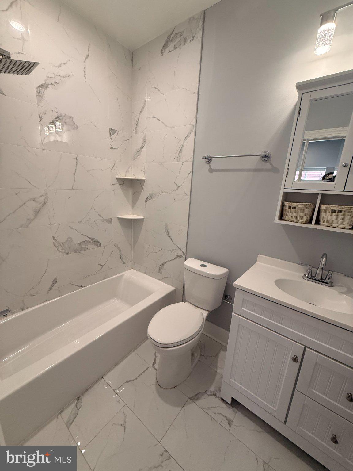 1813 South 23rd Street, Unit 2 Philadelphia, PA 19145 - Photo 5 of 20 a bathroom with a sink toilet vanity and bathtub