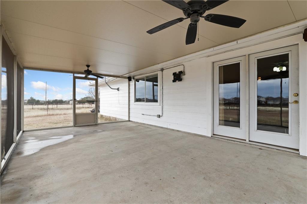 13605 Ralph Ritchie Road Manor, TX 78653 - Photo 5 of 19 Unfurnished sunroom featuring a ceiling fan