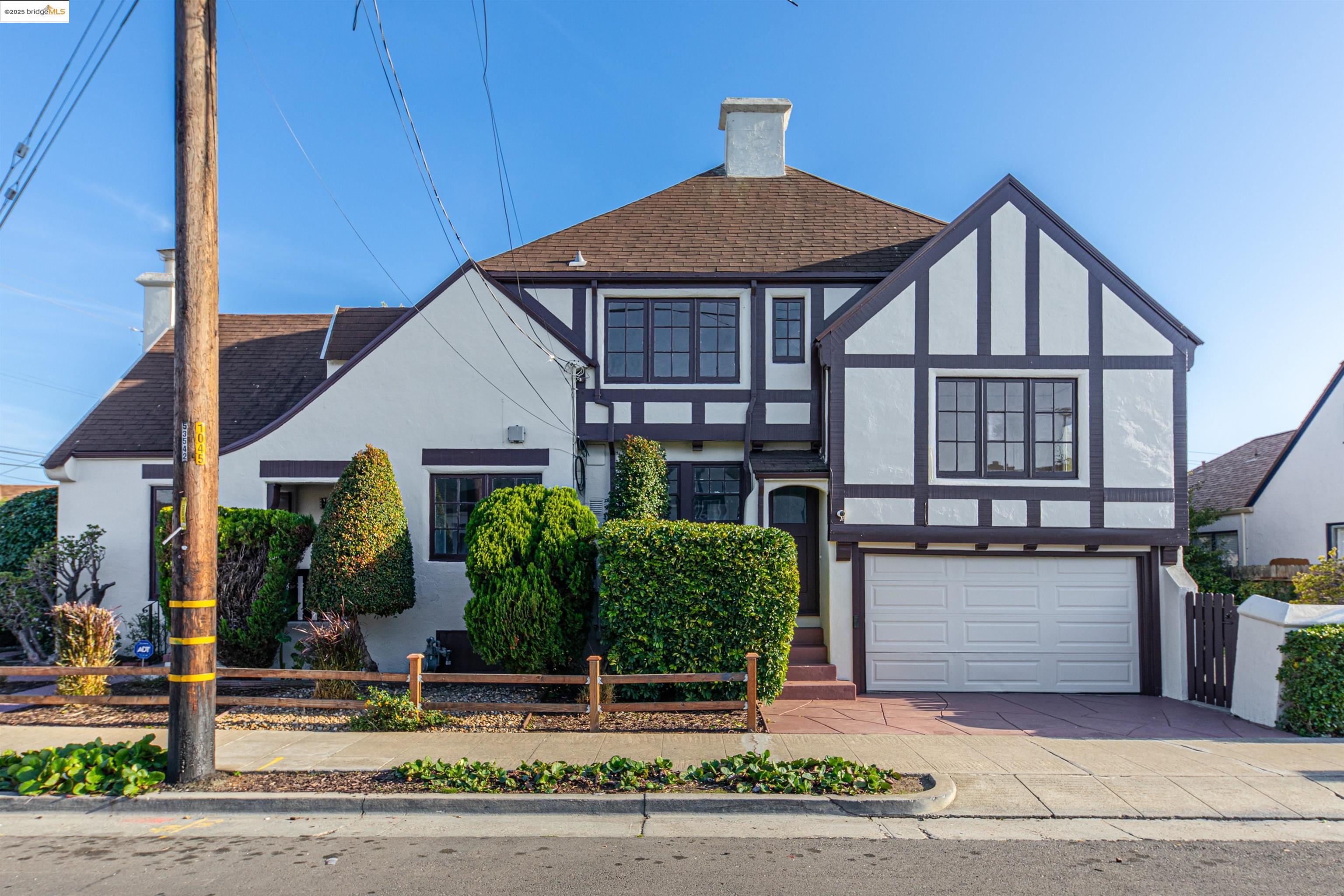 7601 Holly Street Oakland, CA 94621 - Photo 2 of 51 front view of a house with a yard