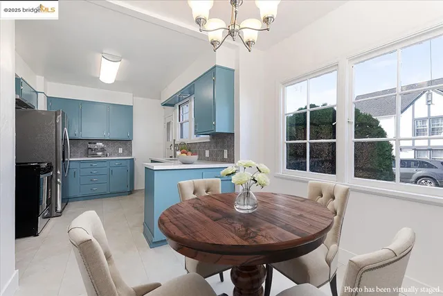 a view of a dining room with furniture window and outside view