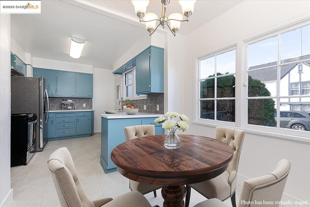 7601 Holly Street Oakland, CA 94621 - Photo 21 of 51 a view of a dining room with furniture window and outside view