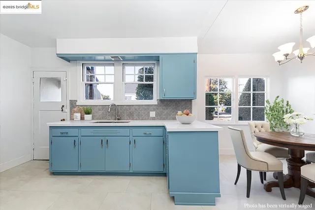 a kitchen with stainless steel appliances a sink stove and refrigerator
