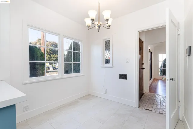 a kitchen with stainless steel appliances a refrigerator and cabinets