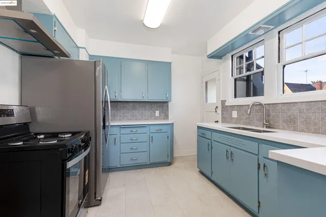 a kitchen with a stove and a refrigerator