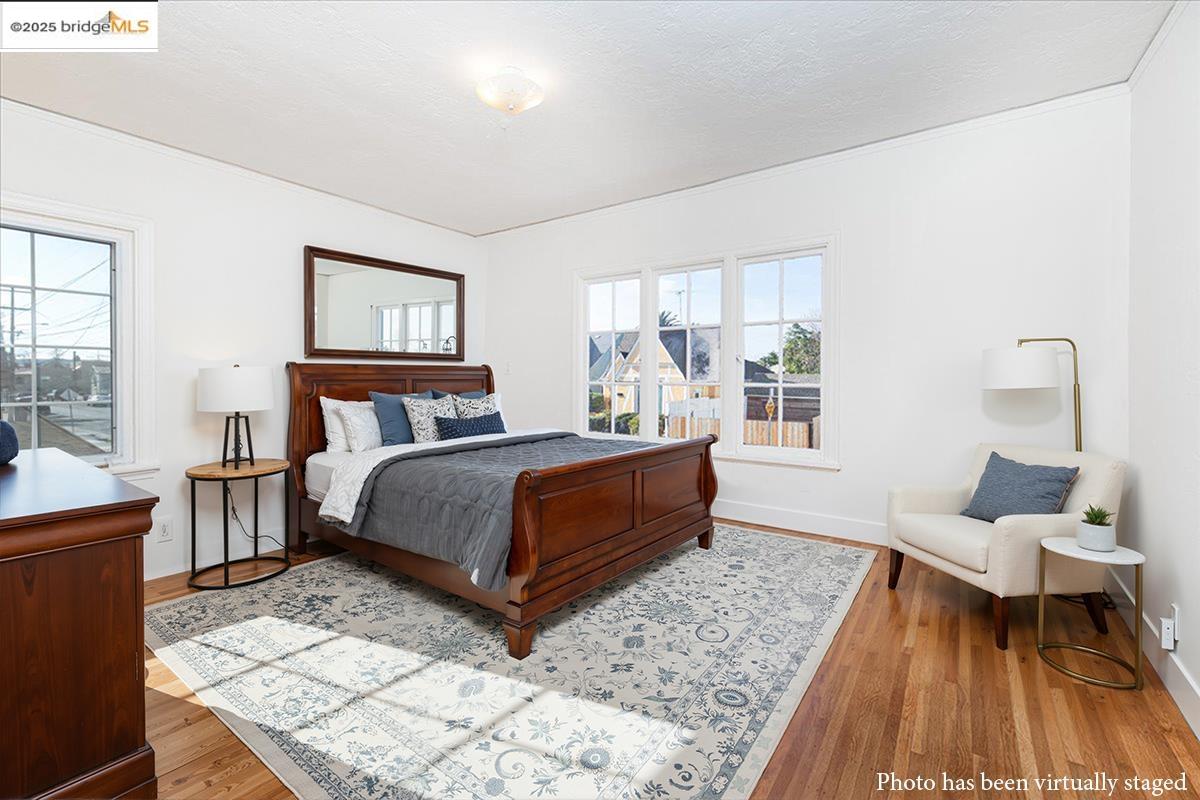 7601 Holly Street Oakland, CA 94621 - Photo 32 of 51 a bedroom with a bed and window