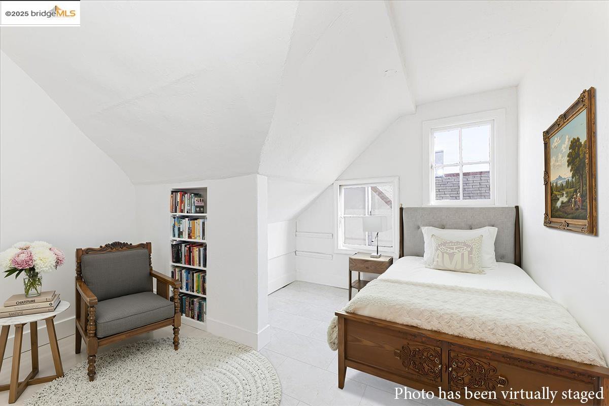 7601 Holly Street Oakland, CA 94621 - Photo 39 of 51 a bedroom with a bed and window