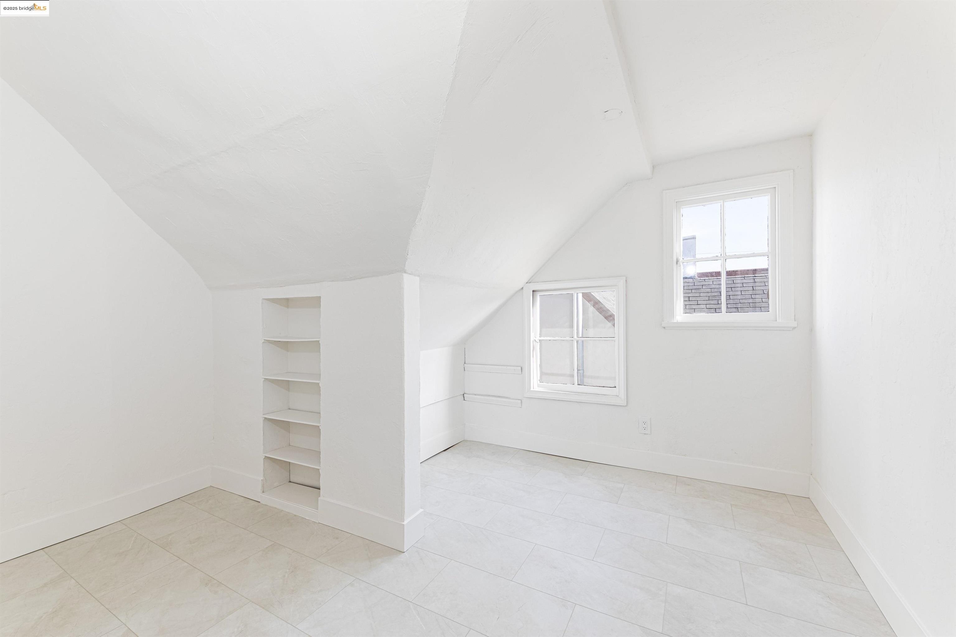 7601 Holly Street Oakland, CA 94621 - Photo 40 of 51 an empty room with windows