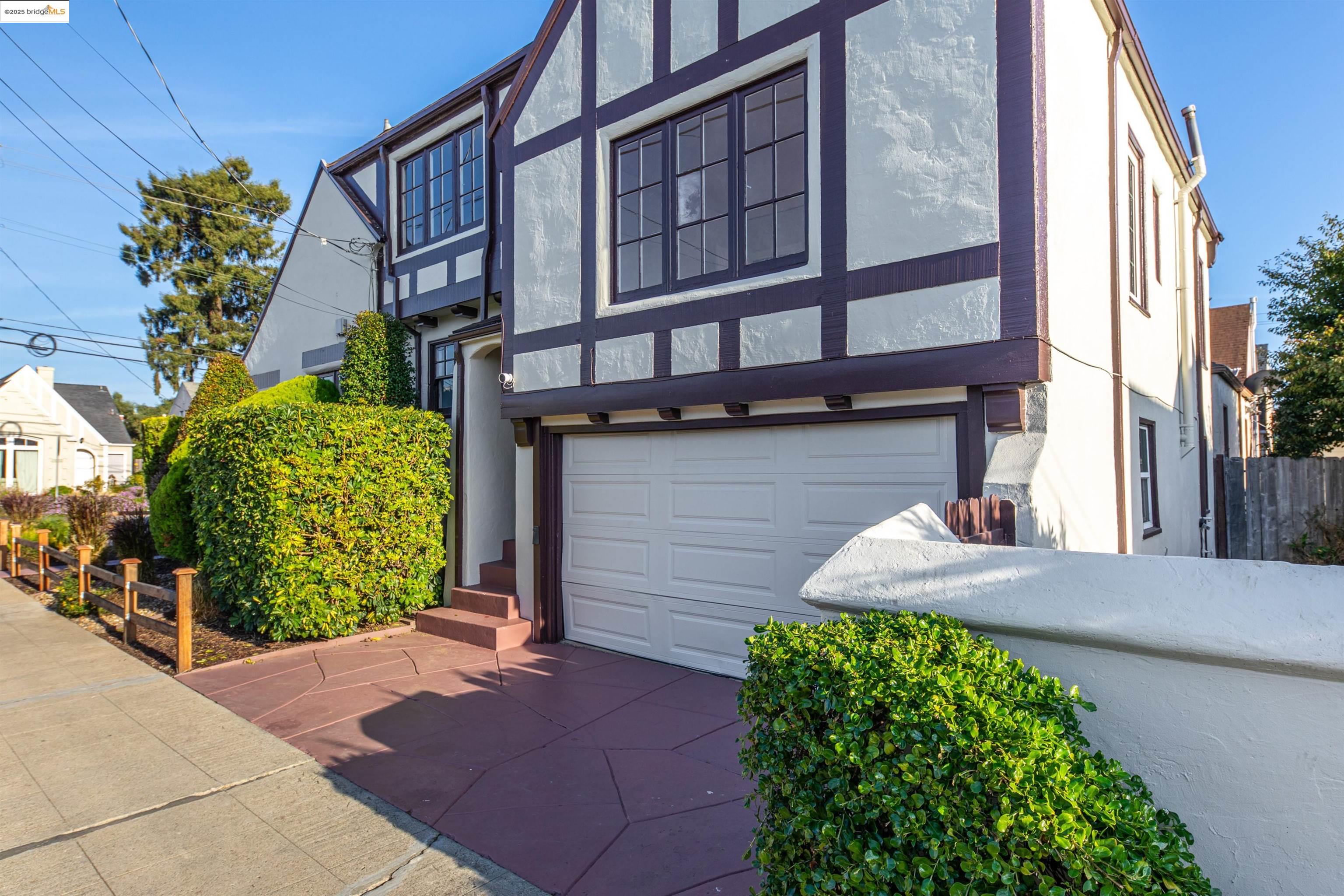 7601 Holly Street Oakland, CA 94621 - Photo 4 of 51 a front view of a house with garden