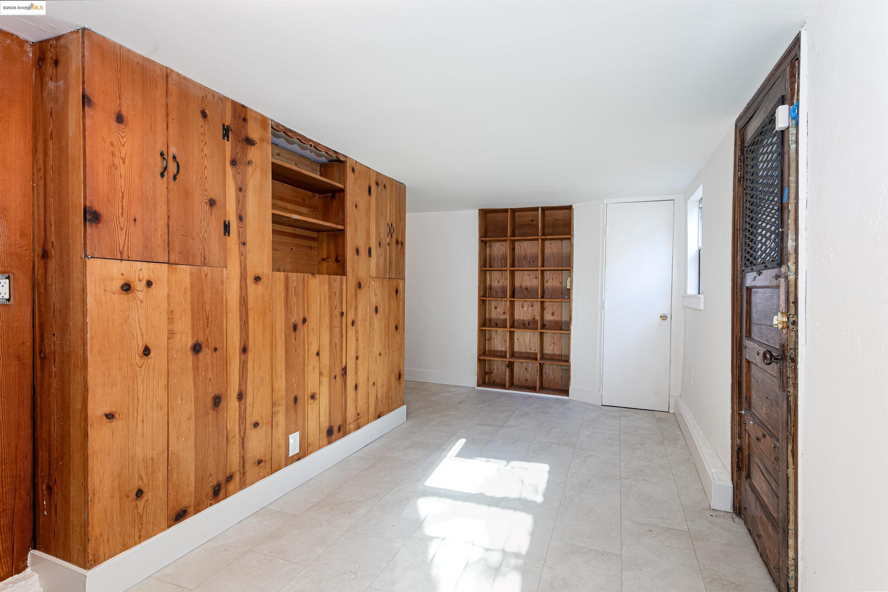 7601 Holly Street Oakland, CA 94621 - Photo 44 of 51 a view of an empty room with windows