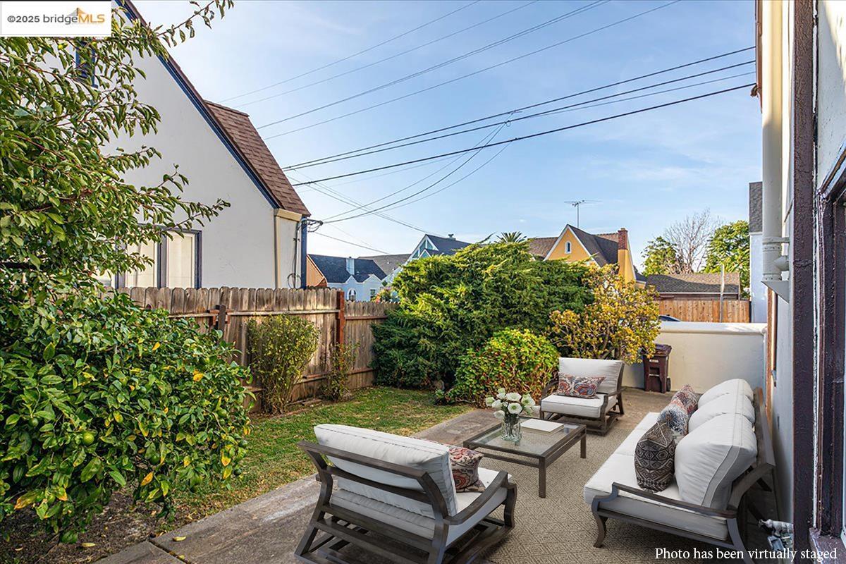 7601 Holly Street Oakland, CA 94621 - Photo 46 of 51 a backyard of a house with outdoor seating
