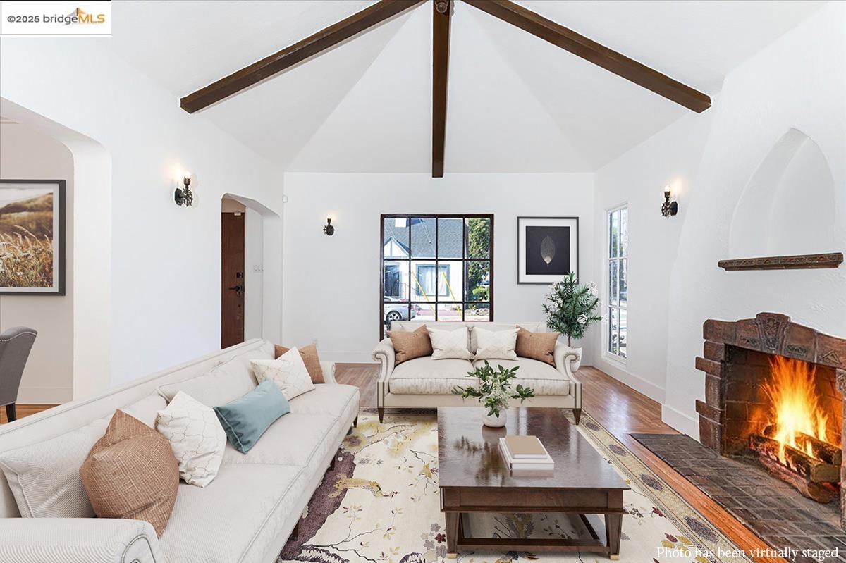 7601 Holly Street Oakland, CA 94621 - Photo 8 of 51 a living room with furniture and a flat screen tv