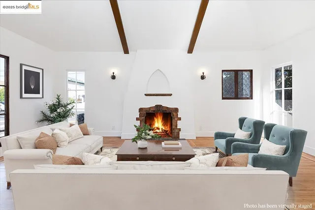 a living room with furniture and a mirror