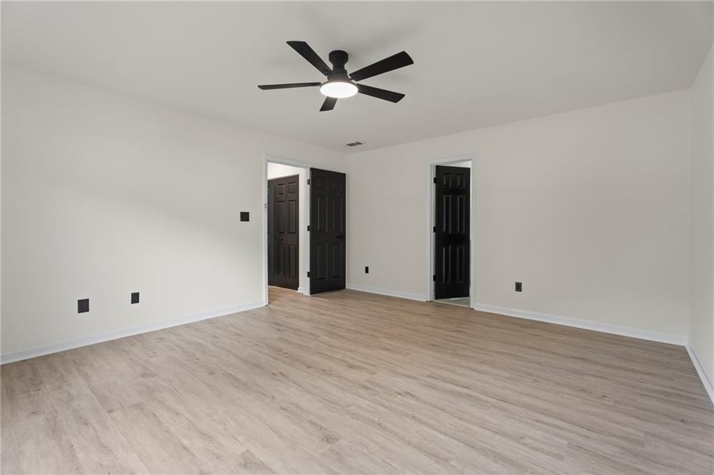 3602 Bristol Overlook Rex, GA 30273 - Photo 27 of 37 a view of a livingroom with a ceiling fan and wooden floor