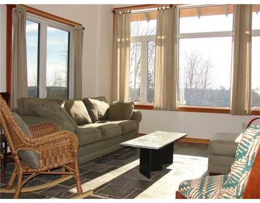 1 Sidney Road Alna, ME 04535 - Photo 4 of 12 Living Room. Slate floor passively...