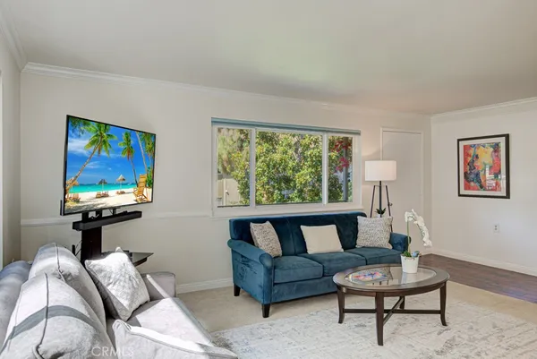 a living room with furniture and a window