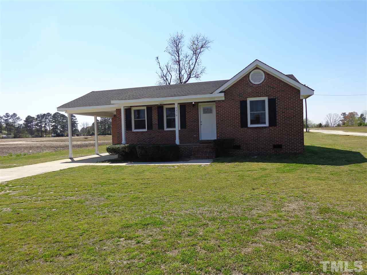 5310 Fairground Road Dunn, NC 28334 - Photo 13 of 13 a front view of a house with garden