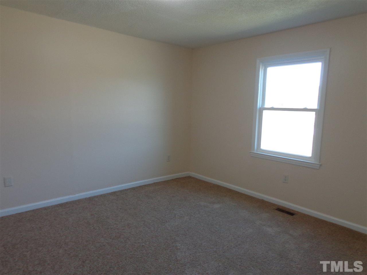 5310 Fairground Road Dunn, NC 28334 - Photo 5 of 13 an empty room with a window
