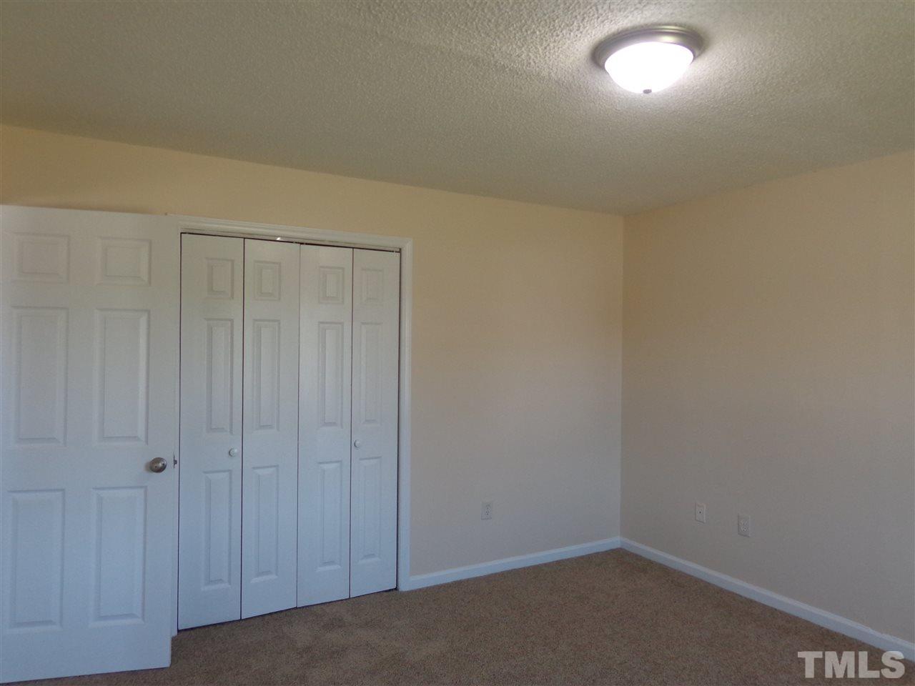 5310 Fairground Road Dunn, NC 28334 - Photo 6 of 13 an empty room with a workbench