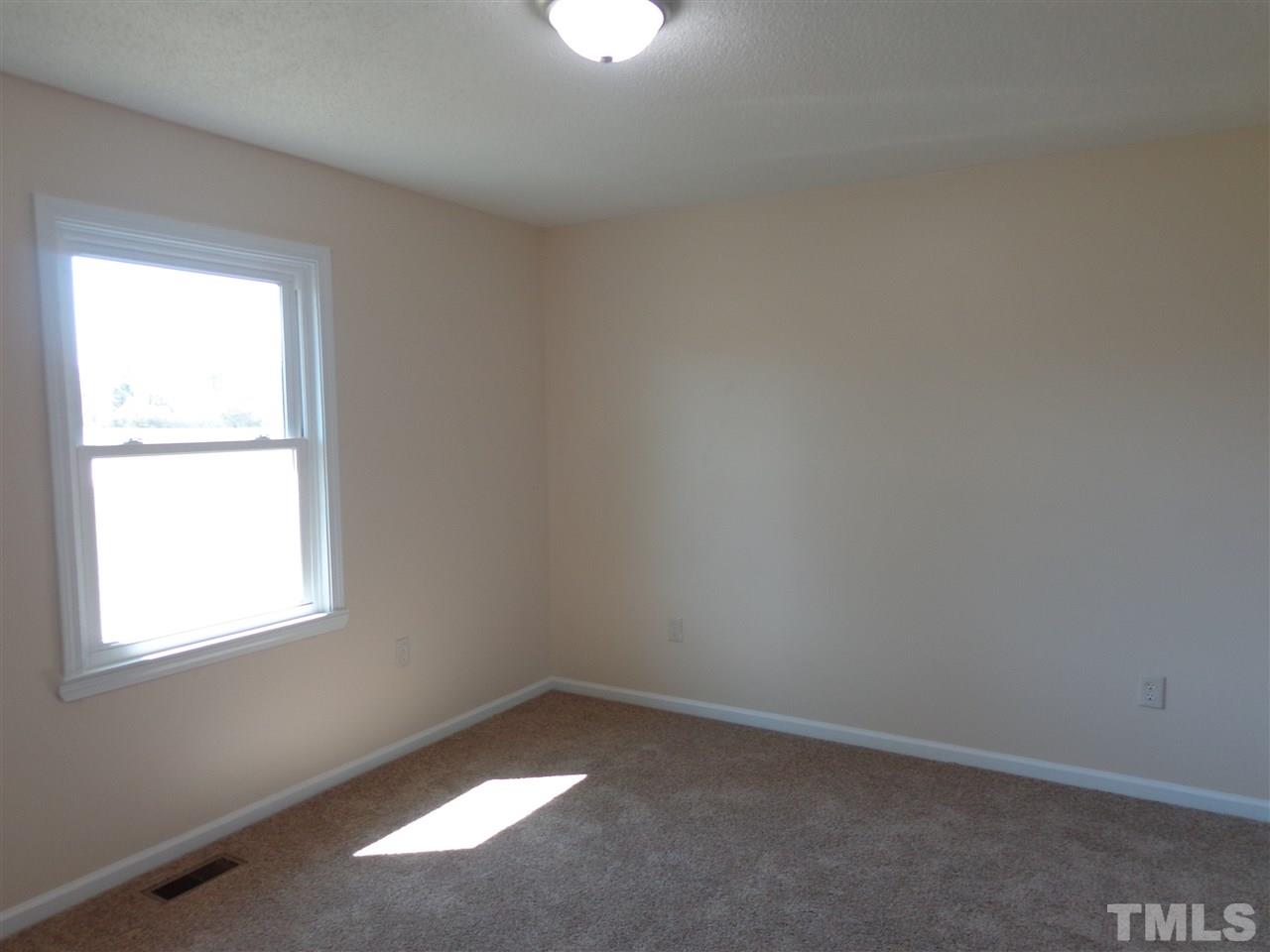 5310 Fairground Road Dunn, NC 28334 - Photo 8 of 13 an empty room with a window