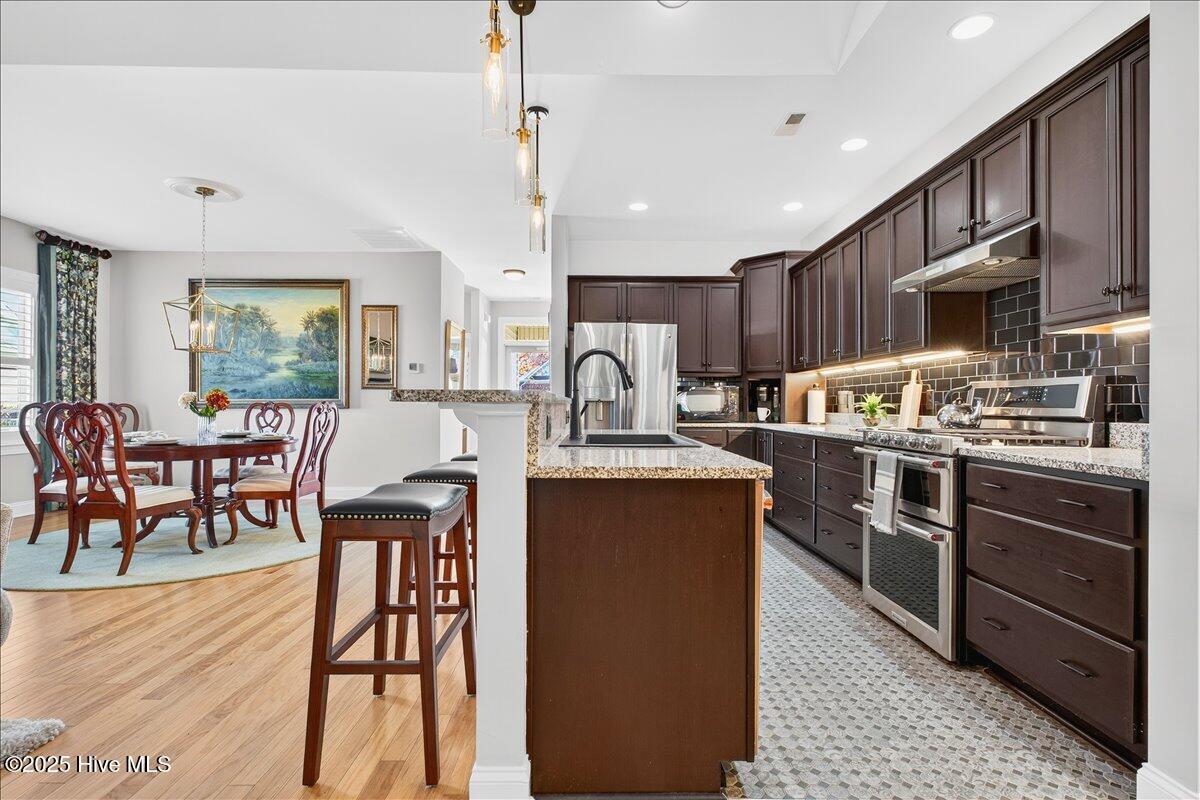 4173 Cambridge Cove Road, Unit 2 Southport, NC 28461 - Photo 9 of 66 kitchen with space to eat at island