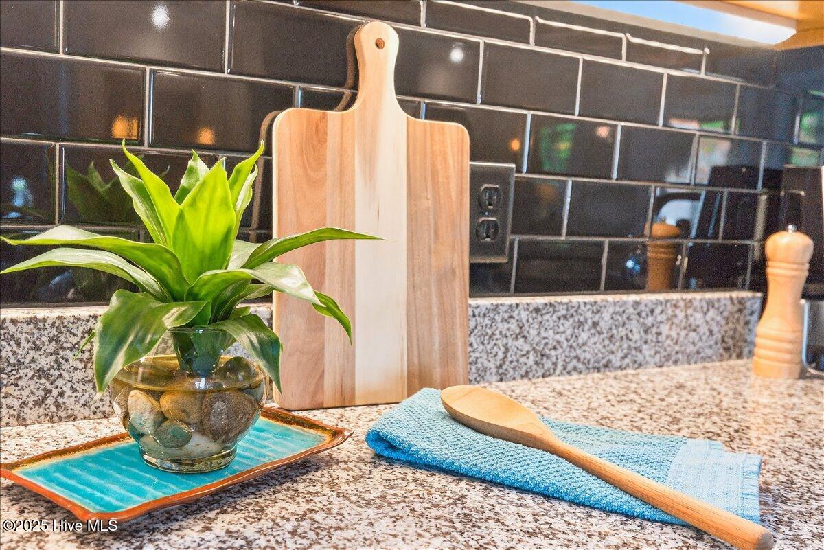 4173 Cambridge Cove Road, Unit 2 Southport, NC 28461 - Photo 13 of 66 Tile backsplash and granite countertops