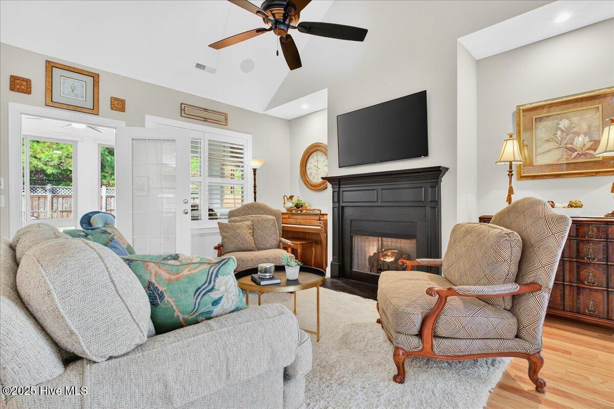 4173 Cambridge Cove Road, Unit 2 Southport, NC 28461 - Photo 15 of 66 Family room flows into four seasons room