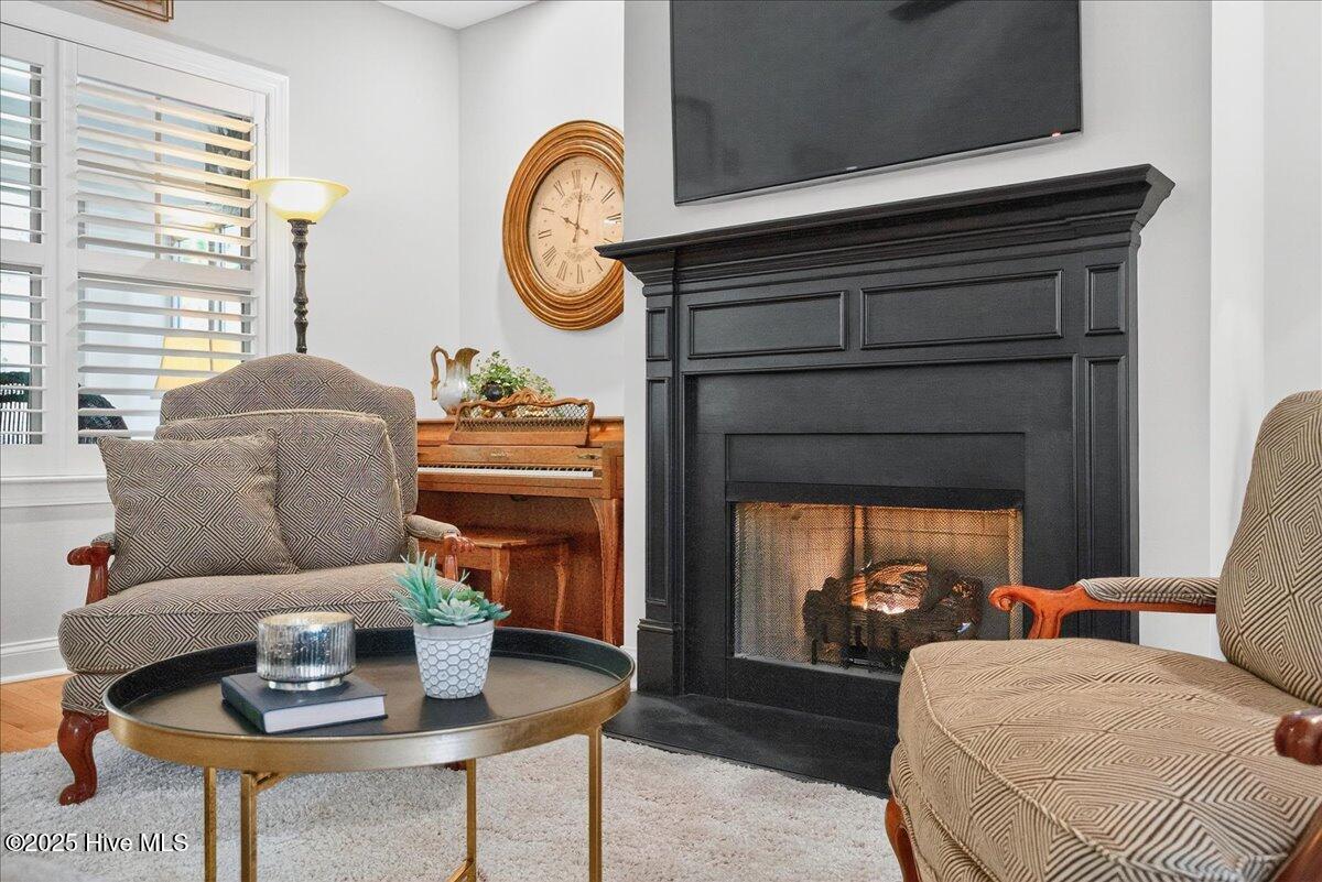 4173 Cambridge Cove Road, Unit 2 Southport, NC 28461 - Photo 20 of 66 Cozy spot by the fireplace to enjoy conversation