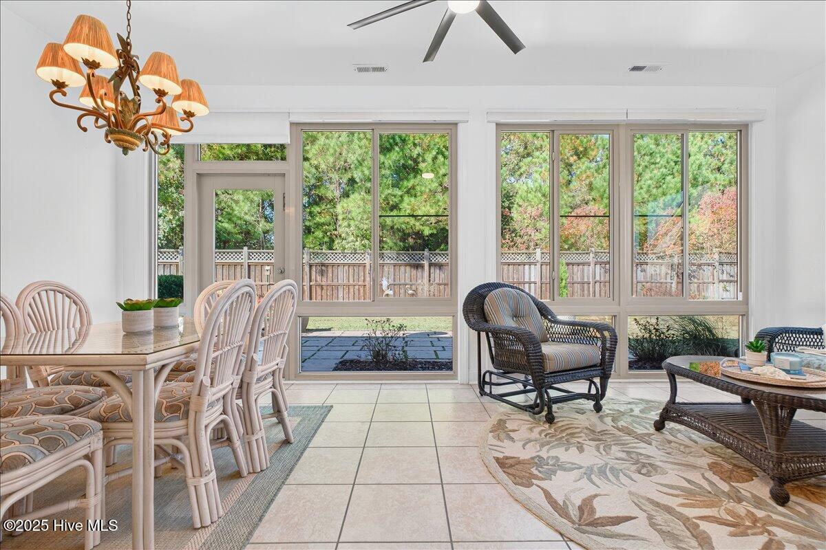 4173 Cambridge Cove Road, Unit 2 Southport, NC 28461 - Photo 22 of 66 Family room flows into sunny four seasons room