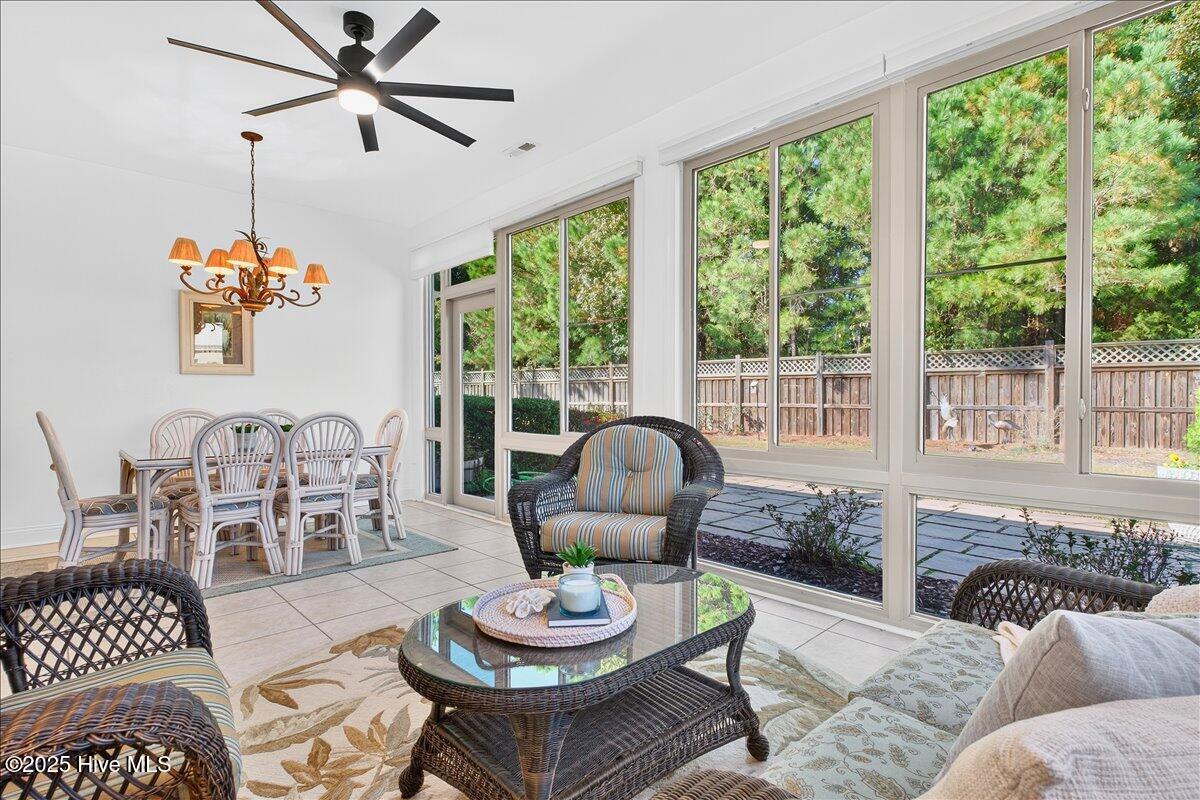 4173 Cambridge Cove Road, Unit 2 Southport, NC 28461 - Photo 23 of 66 Four seasons room with large sliding windows opens to rear patio
