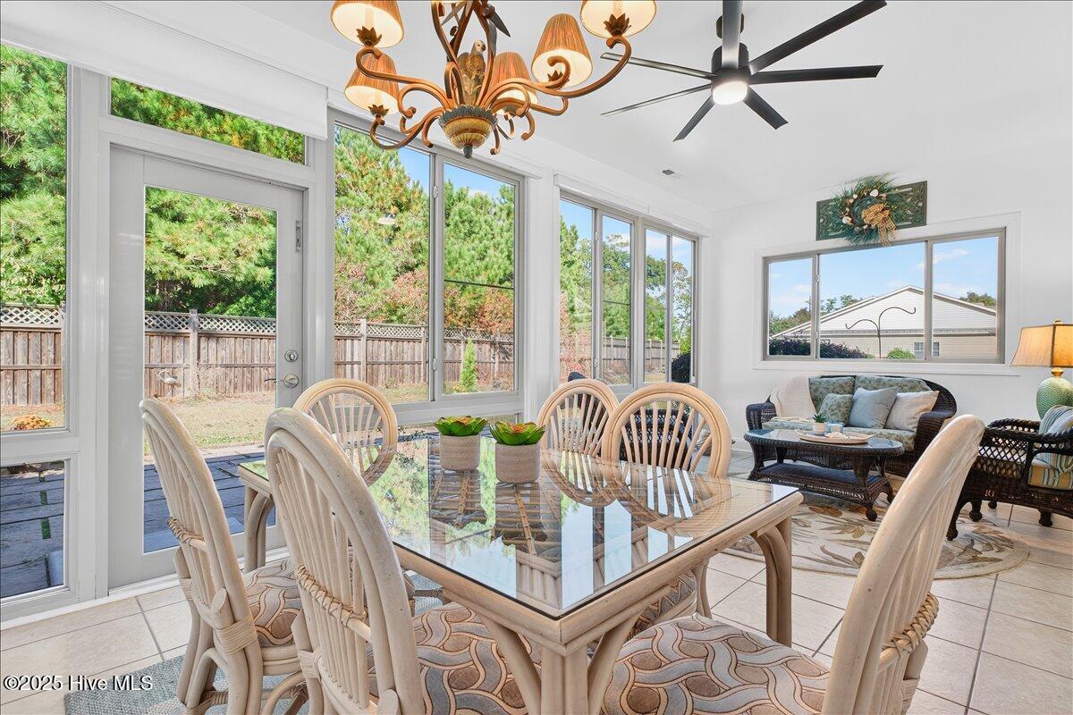 4173 Cambridge Cove Road, Unit 2 Southport, NC 28461 - Photo 24 of 66 Perfect spot to have a bite to eat while enjoying the sunshine in four seasons room
