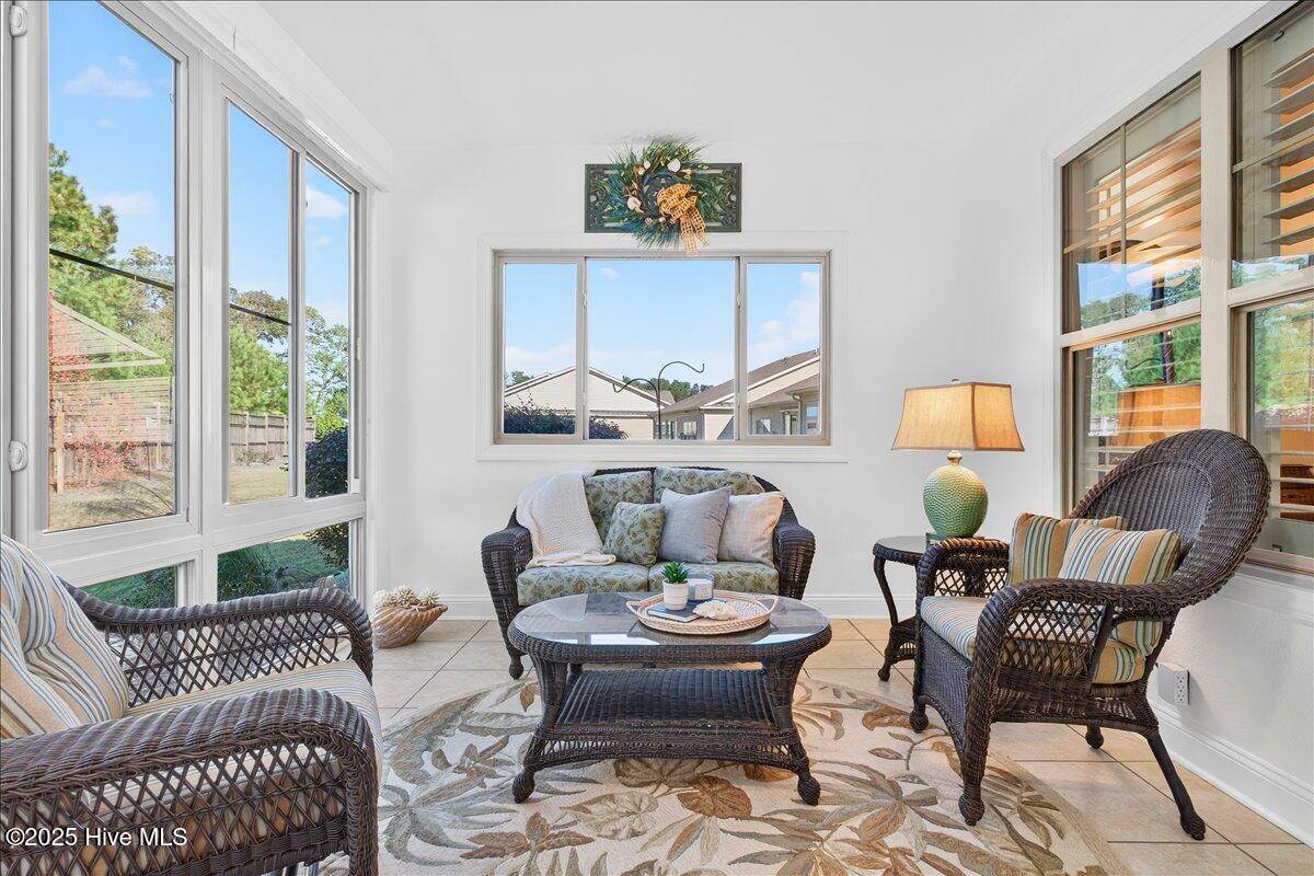 4173 Cambridge Cove Road, Unit 2 Southport, NC 28461 - Photo 26 of 66 Four seasons room offers lovely spot to relax