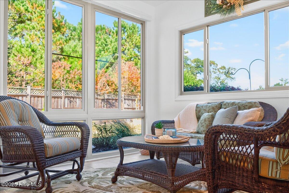 4173 Cambridge Cove Road, Unit 2 Southport, NC 28461 - Photo 27 of 66 Four seasons room offers lovely spot to relax