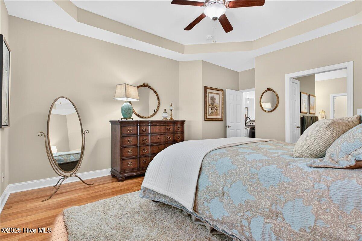 4173 Cambridge Cove Road, Unit 2 Southport, NC 28461 - Photo 29 of 66 Generously sized primary bedroom with tray ceiling