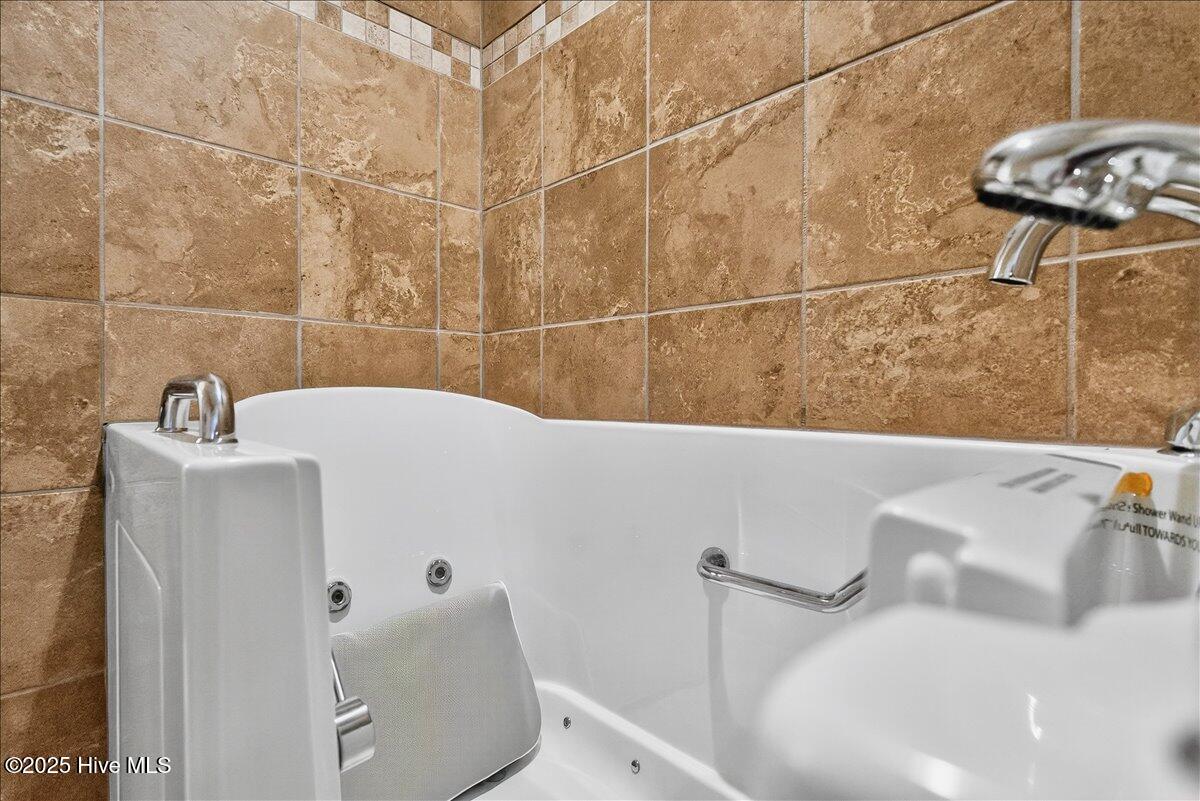 4173 Cambridge Cove Road, Unit 2 Southport, NC 28461 - Photo 35 of 66 Convenient walk in tub