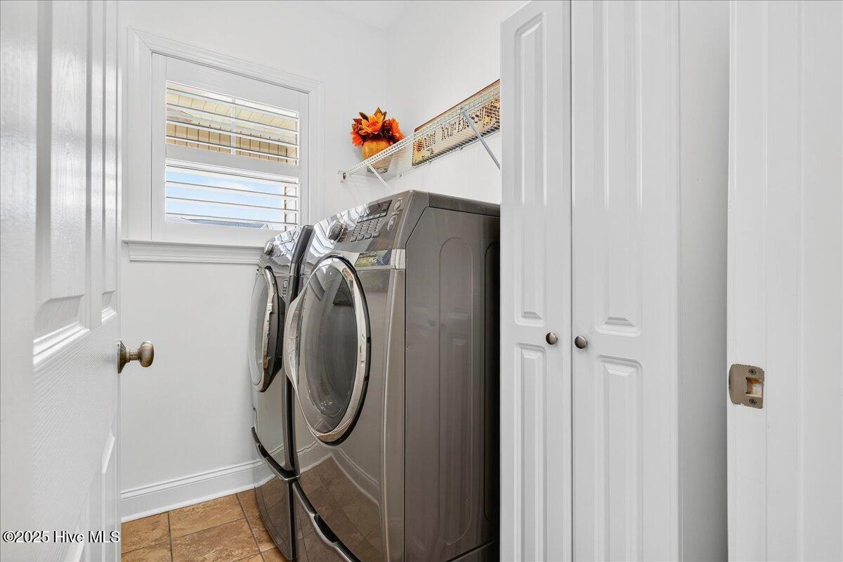 4173 Cambridge Cove Road, Unit 2 Southport, NC 28461 - Photo 44 of 66 Laundry room offers front loading washer and dryer which convey
