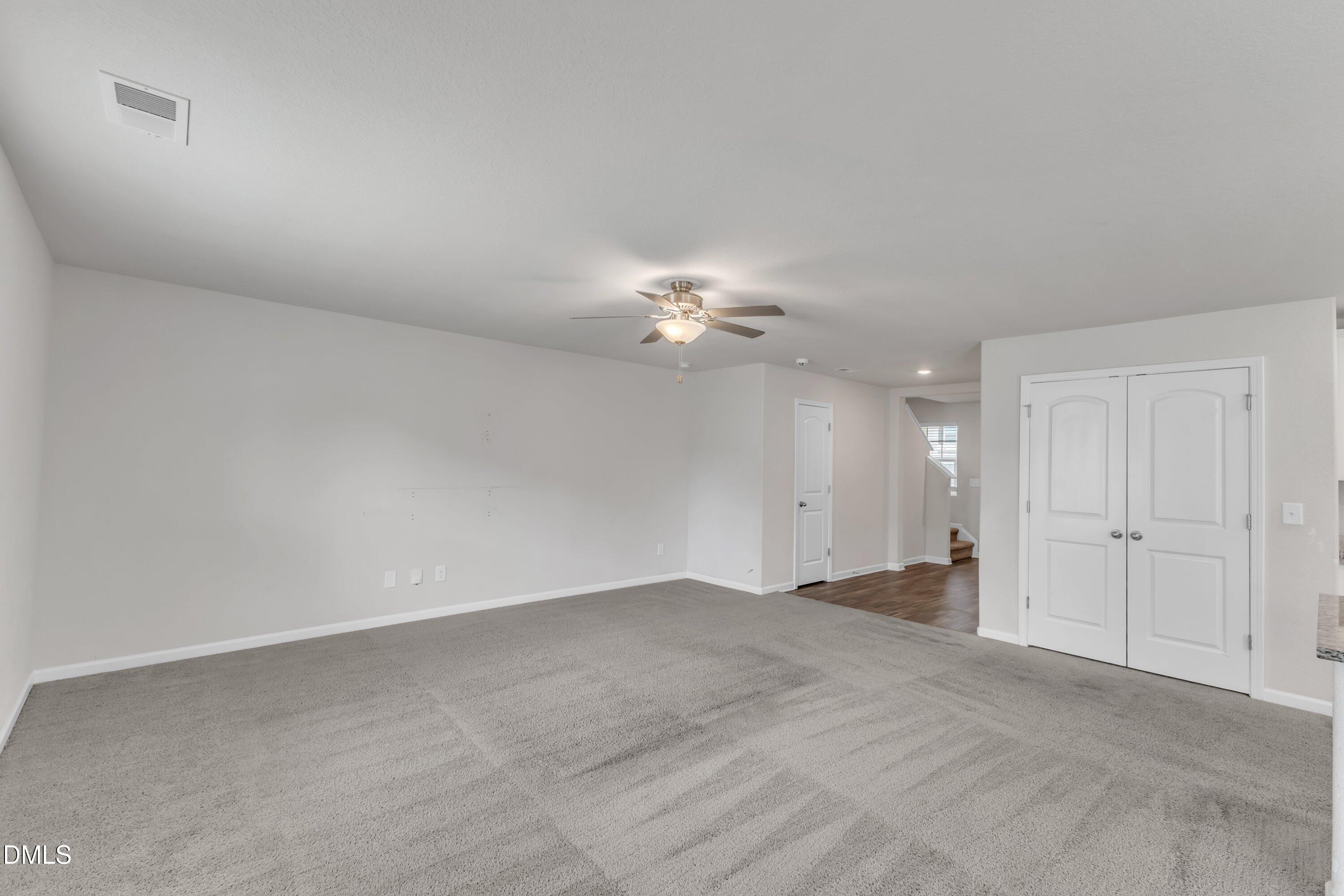 717 Little Patch Street Zebulon, NC 27597 - Photo 11 of 36 a view of an empty room with a fan