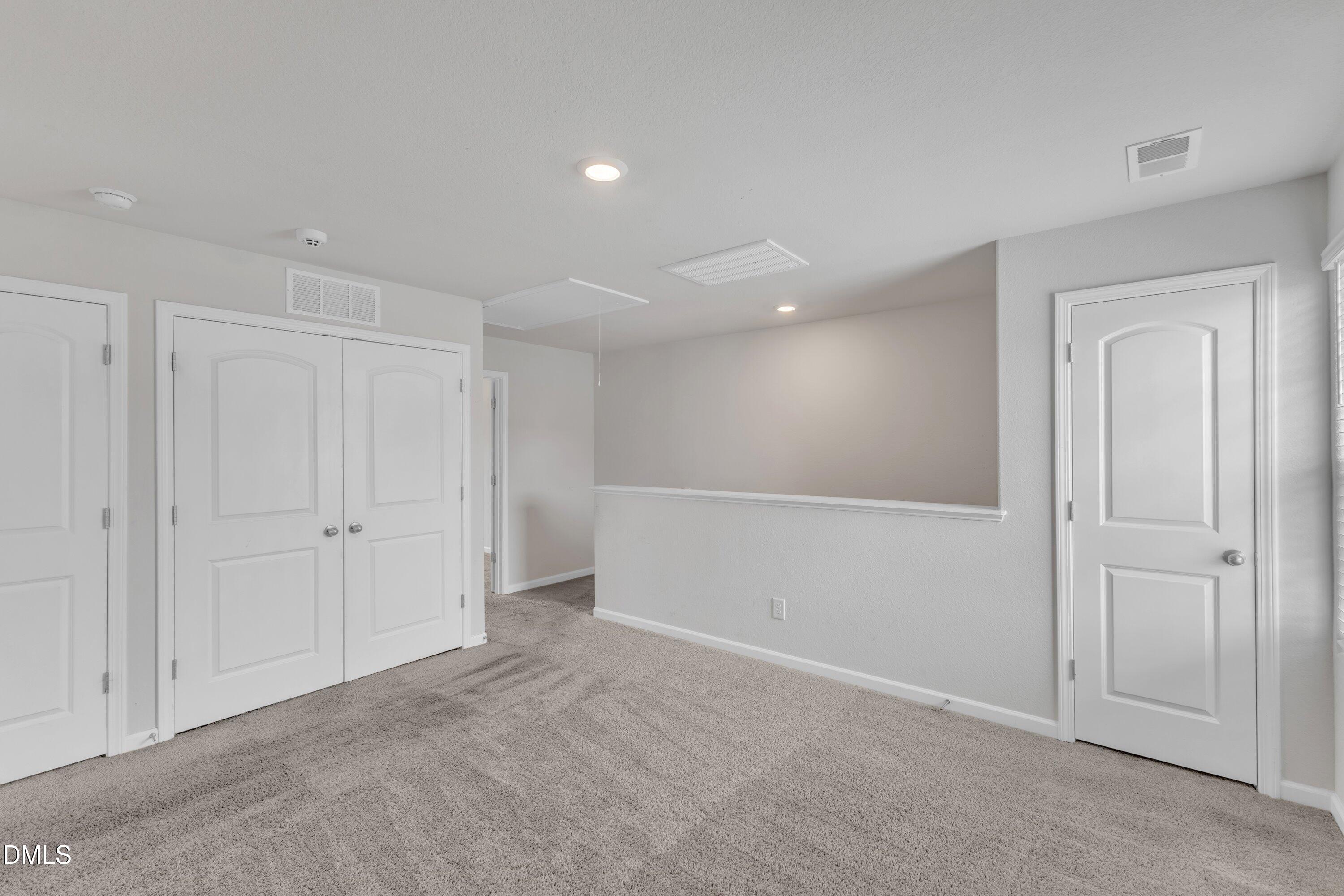 717 Little Patch Street Zebulon, NC 27597 - Photo 22 of 36 a view of an empty room