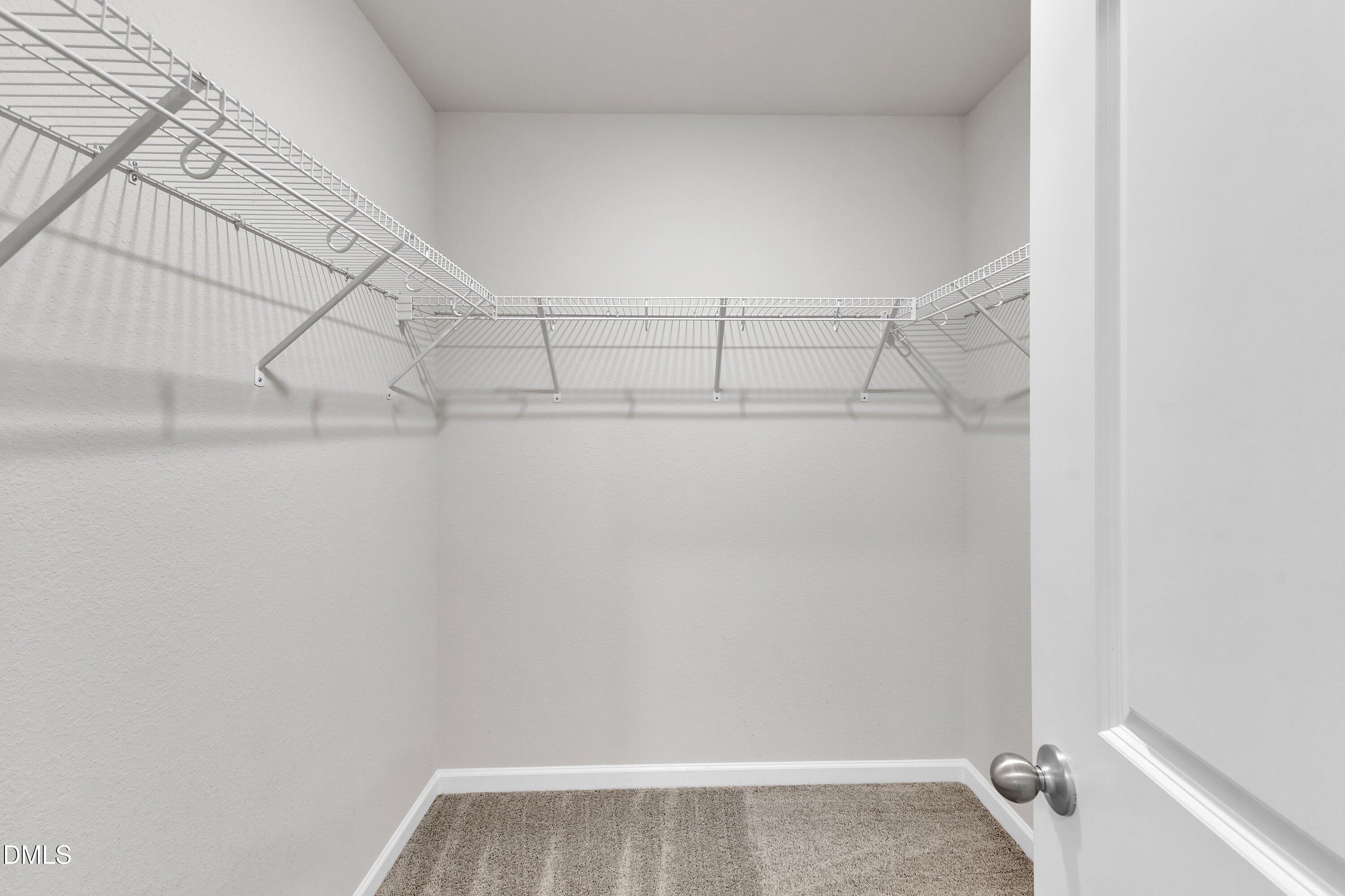 717 Little Patch Street Zebulon, NC 27597 - Photo 28 of 36 a view of a room with racks on the wall