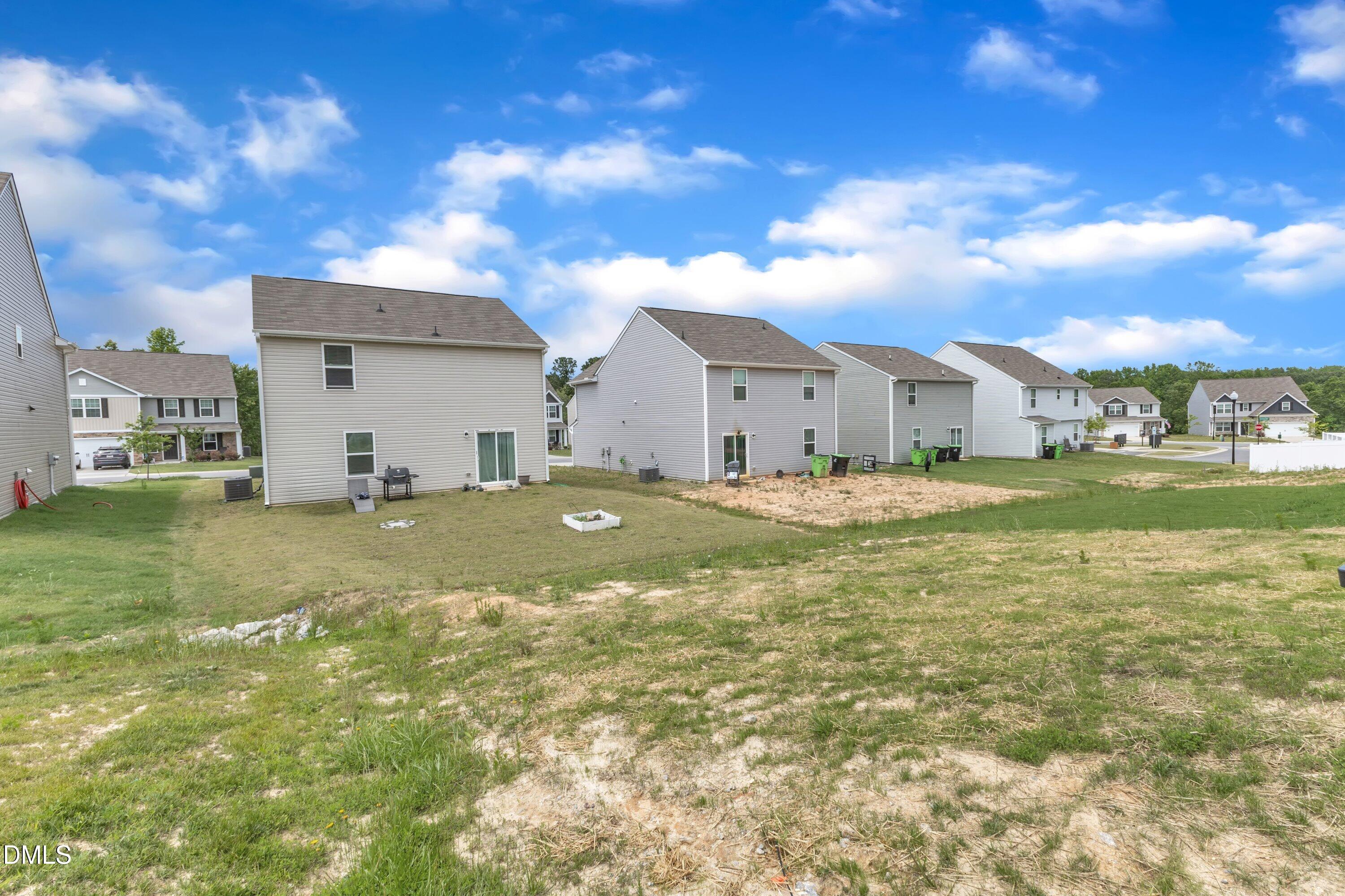 717 Little Patch Street Zebulon, NC 27597 - Photo 34 of 36 a view of a house with a big yard