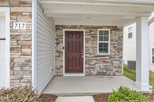 a front view of a house with a garage
