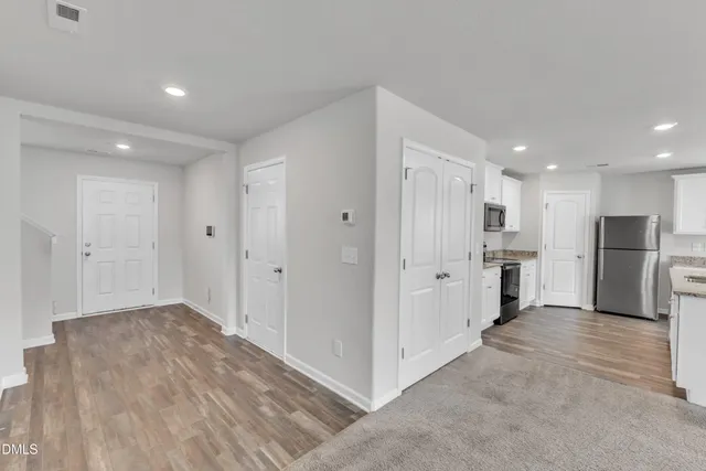 a view of a kitchen with refrigerator