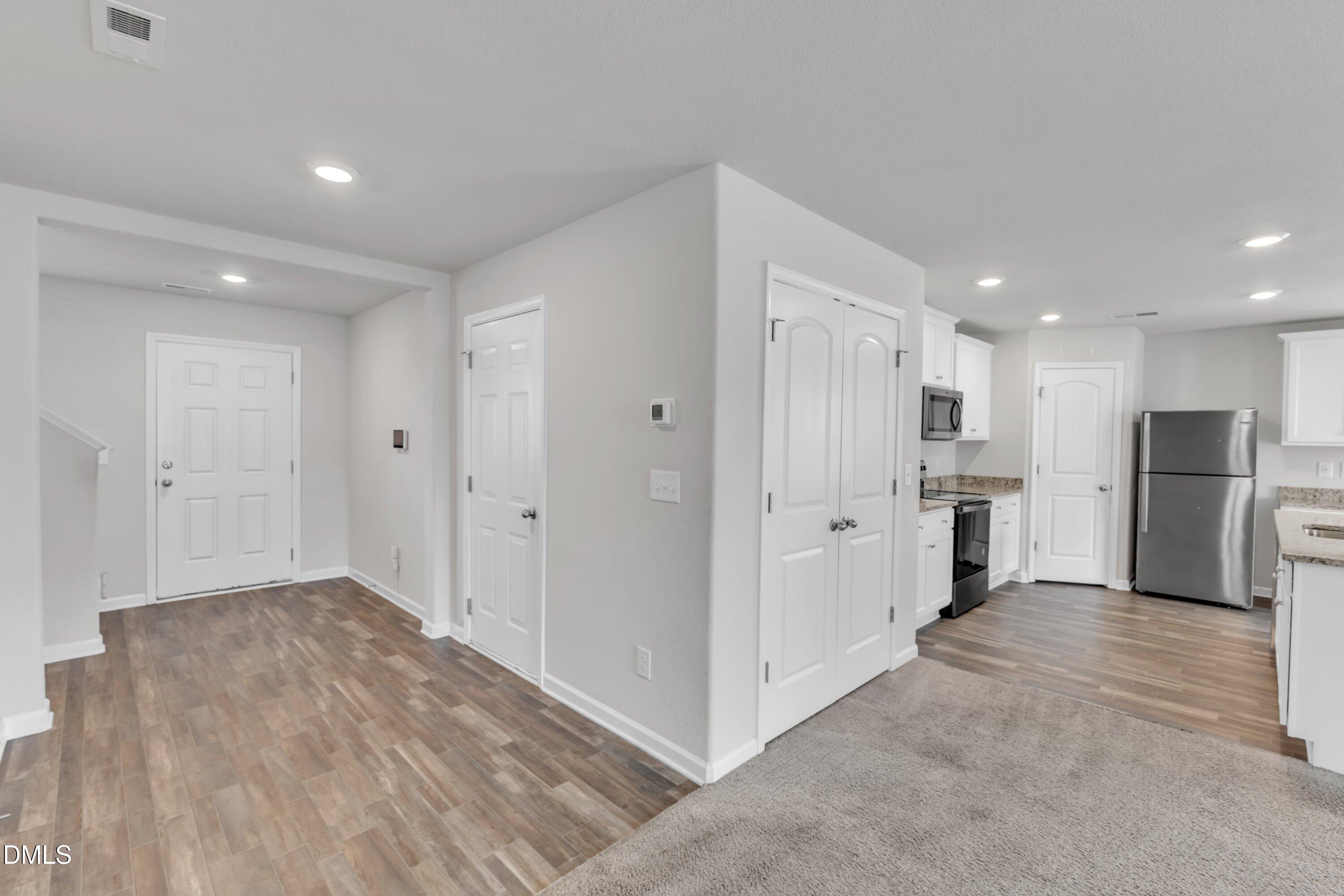 717 Little Patch Street Zebulon, NC 27597 - Photo 7 of 36 a view of a kitchen with refrigerator