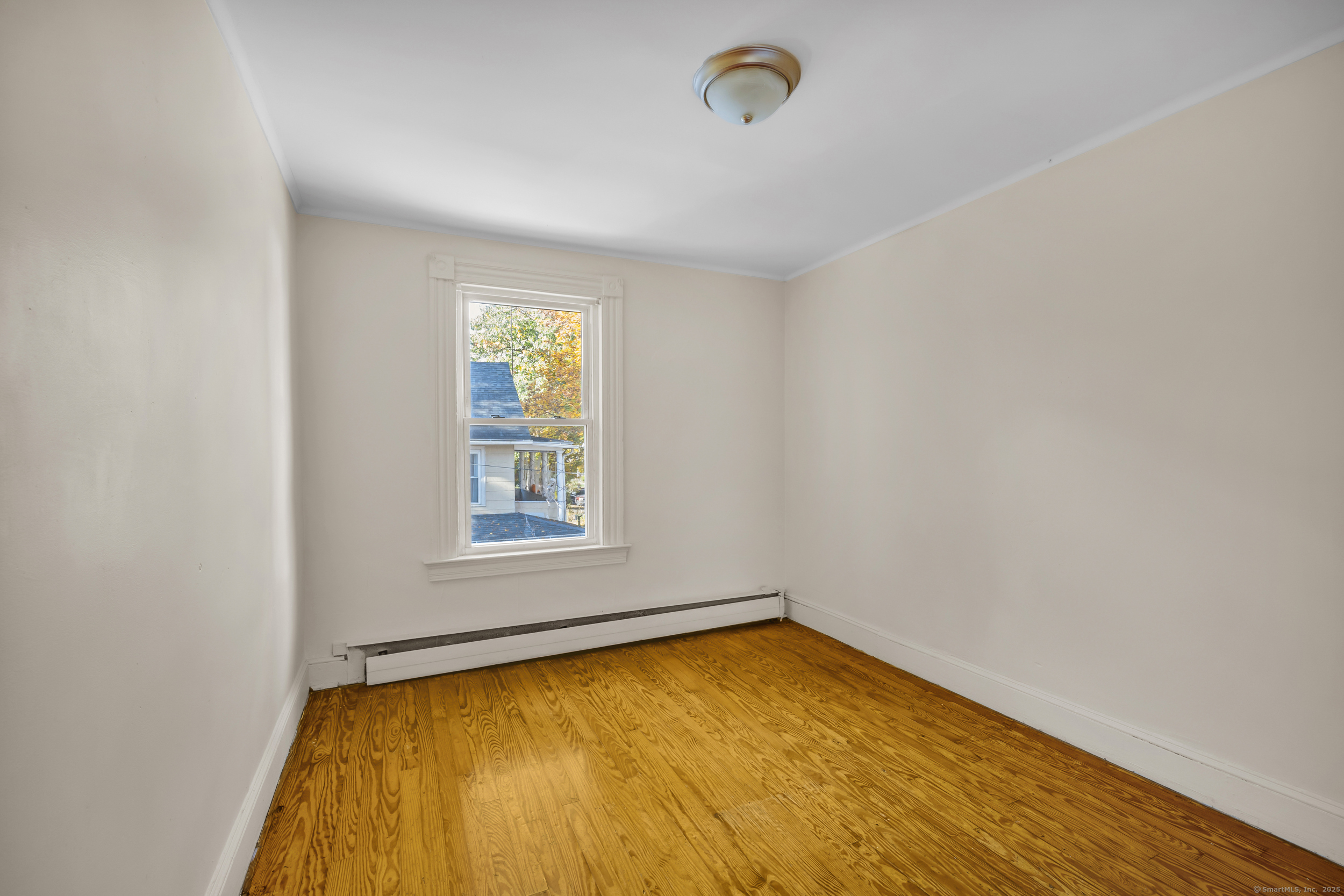 31 Wolcott Avenue, Unit 2 Torrington, CT 06790 - Photo 11 of 22 an empty room with a window