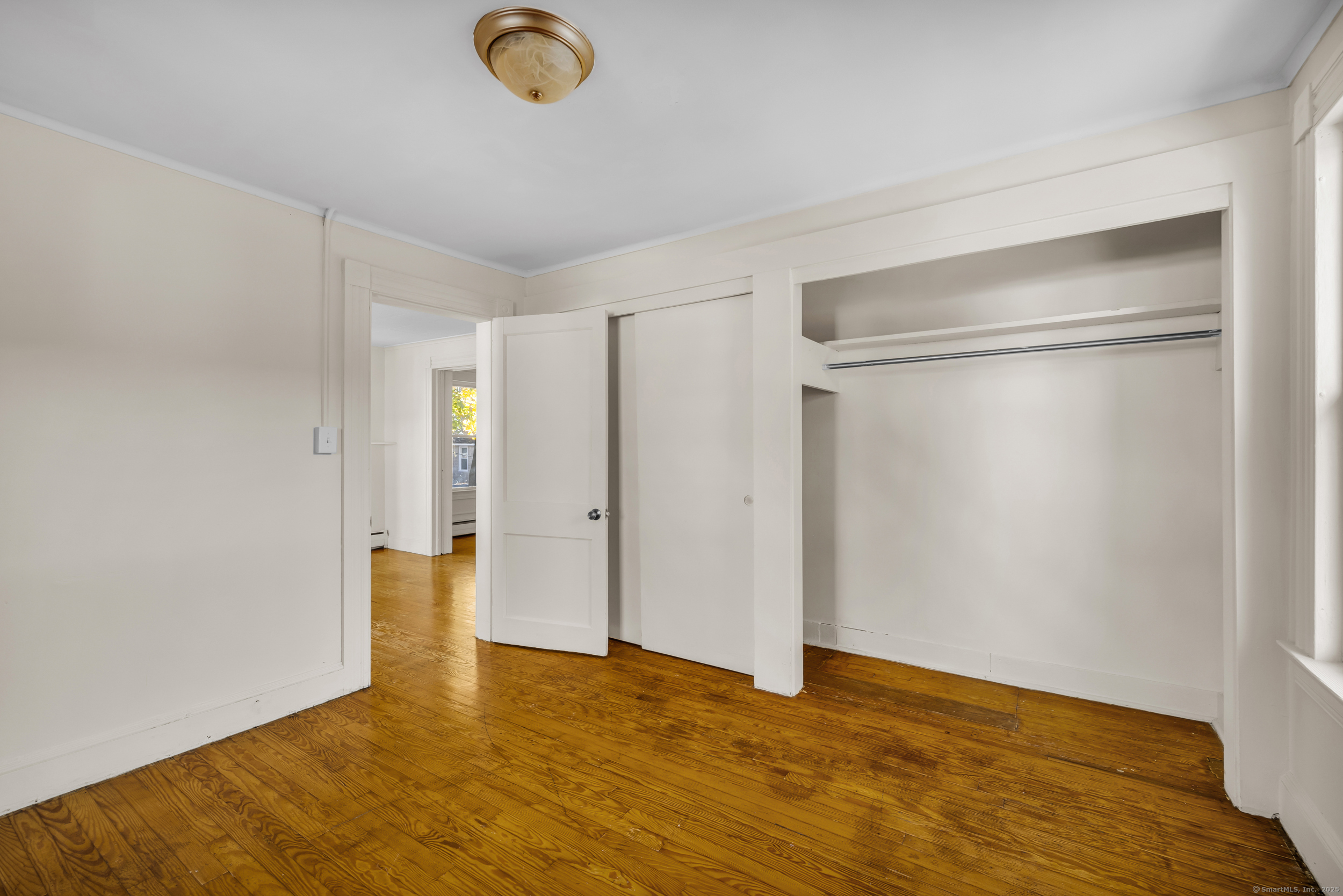 31 Wolcott Avenue, Unit 2 Torrington, CT 06790 - Photo 14 of 22 a view of empty room with wooden floor