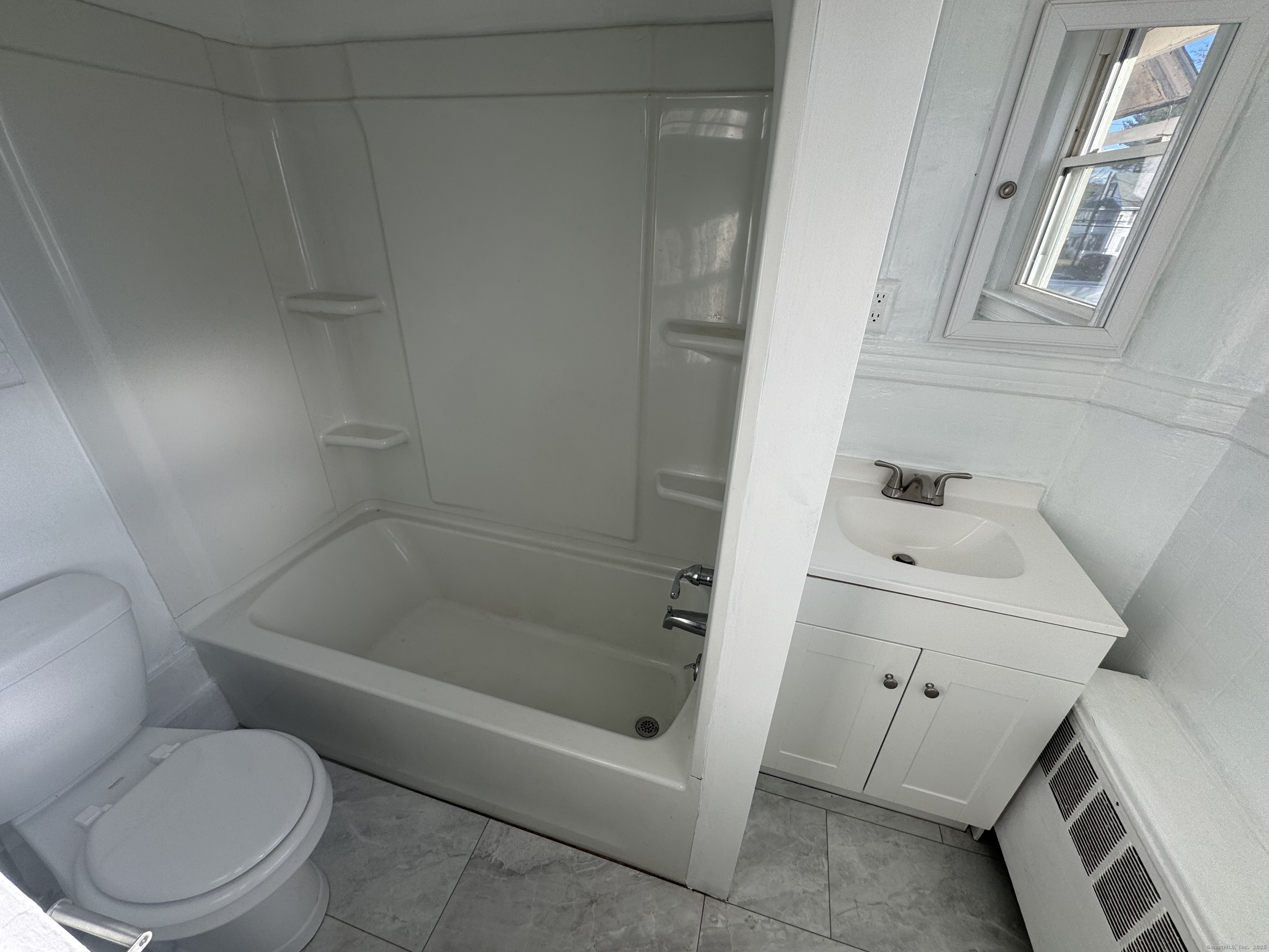 31 Wolcott Avenue, Unit 2 Torrington, CT 06790 - Photo 16 of 22 a bathroom with a sink and a toilet