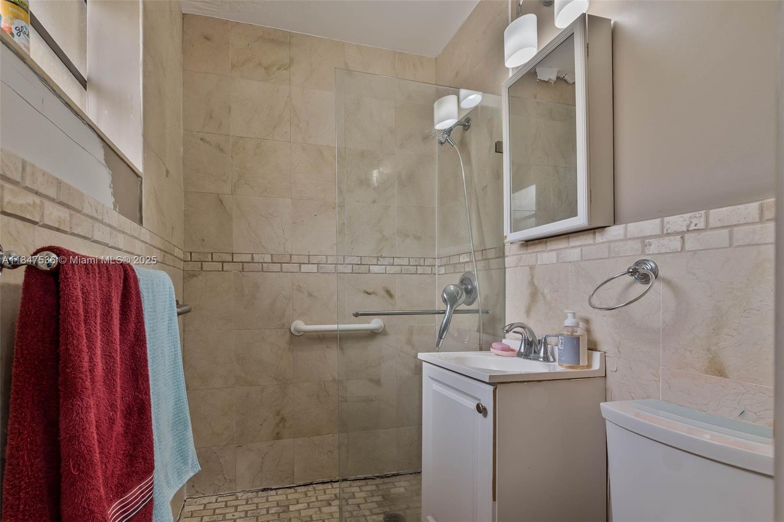 1621 Southwest 23rd Avenue Miami, FL 33145 - Photo 16 of 25 a bathroom with a sink and a mirror