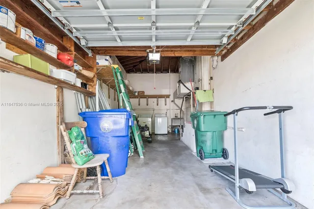 a view of a garage with wooden chairs