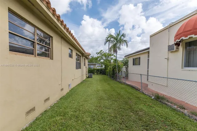 a view of a back yard of the house