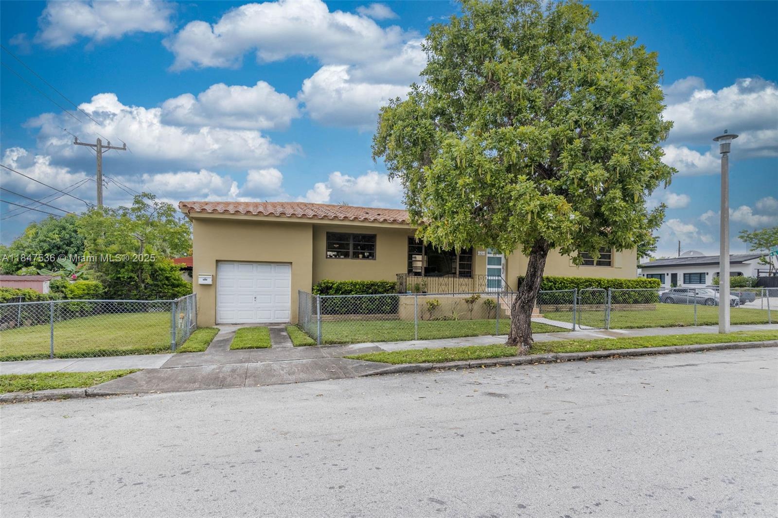 1621 Southwest 23rd Avenue Miami, FL 33145 - Photo 25 of 25 a view of a house with a big yard and large trees