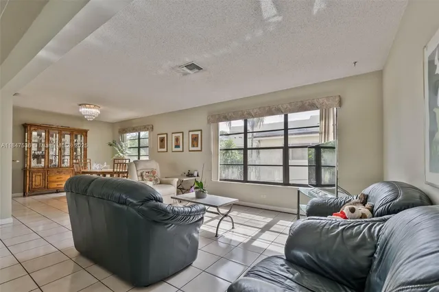 a living room with furniture and windows